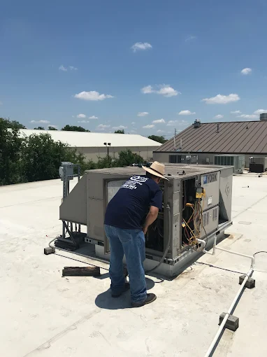 A-OK Services technician performing furnace repair in San Antonio